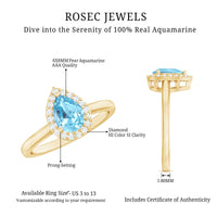 Pear cut aquamarine engagement ring with diamond halo, featuring a 1-carat center stone and intricate band design by Rosec Jewels.