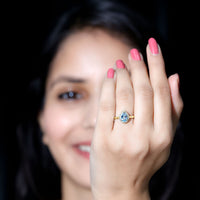 Pear-shaped aquamarine engagement ring with diamond halo by Rosec Jewels, featuring a 1-carat center stone and intricate band details.