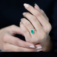 Oval emerald engagement ring with diamond halo from Rosec Jewels, showcasing a 6x8mm genuine emerald and sparkling diamonds.