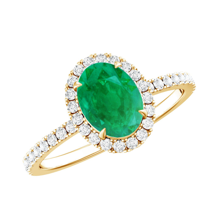 Genuine 6x8mm oval emerald engagement ring with diamond halo by Rosec Jewels, featuring a silver band and intricate design.