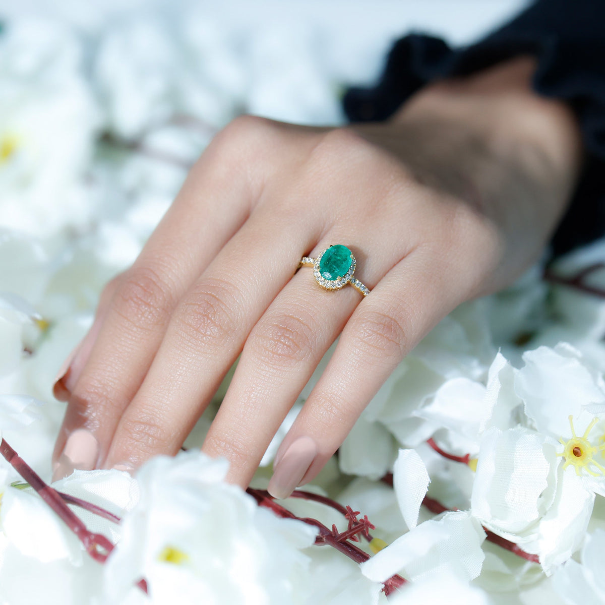 Genuine 6x8mm oval emerald engagement ring with diamond halo from Rosec Jewels, showcasing the detailed design and sparkling stones.