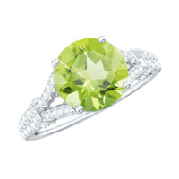 Peridot solitaire engagement ring with moissanite accent stones in a split shank design by Rosec Jewels