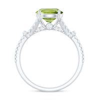 Rosec Jewels peridot solitaire engagement ring with moissanite, featuring a split shank design and elegant gemstone setting.