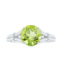 Peridot solitaire engagement ring with moissanite accents and split shank design by Rosec Jewels.