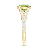 Peridot solitaire engagement ring with moissanite accents in split shank style by Rosec Jewels, showcasing a central green gemstone.