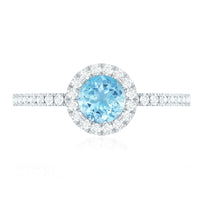 Genuine blue aquamarine ring with diamond accent from Rosec Jewels, featuring a polished aquamarine stone set in a silver band