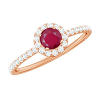 Real 0.6 carat ruby engagement ring with diamond halo from Rosec Jewels, showcasing a stunning central ruby and sparkling halo setting.