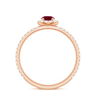 Real 0.6 carat ruby engagement ring with diamond halo from Rosec Jewels, showcasing the vibrant ruby centerpiece and sparkling accent diamonds.