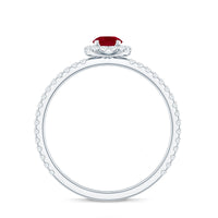 Real 0.6 carat ruby engagement ring with diamond halo, featuring a rose gold band and intricate design by Rosec Jewels.