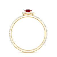 Real 0.6 carat ruby engagement ring with diamond halo from Rosec Jewels, featuring a stunning central ruby and sparkling diamond accents.