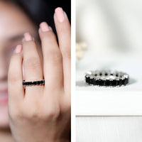 Certified black spinel princess cut eternity band ring featuring sparkling black stones set in a sleek rose gold design.