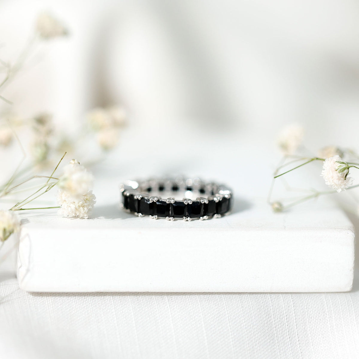 Certified black spinel princess cut eternity band ring by Rosec Jewels, featuring alternating black stones set in a sleek ring design.