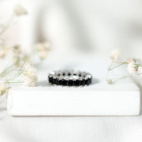 Certified black spinel princess cut eternity band ring by Rosec Jewels, featuring alternating black stones set in a sleek ring design.