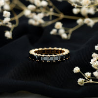 Certified black spinel princess cut eternity band ring featuring sparkling black gemstones set in a sleek ring design.