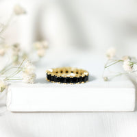 Certified black spinel princess cut eternity band ring by Rosec Jewels, showcasing a continuous row of sparkling black spinel gemstones.