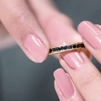 Channel set black spinel eternity ring by Rosec Jewels, showcasing a continuous row of sparkling black spinel stones on a sleek ring band.