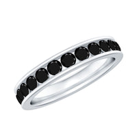 Black spinel eternity ring with channel setting by Rosec Jewels, showcasing a continuous row of sparkling black gemstones on a sleek band.