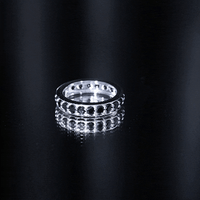 Yellow gold 2.25 CT black spinel eternity band ring from Rosec Jewels featuring a continuous row of sparkling black spinel stones.