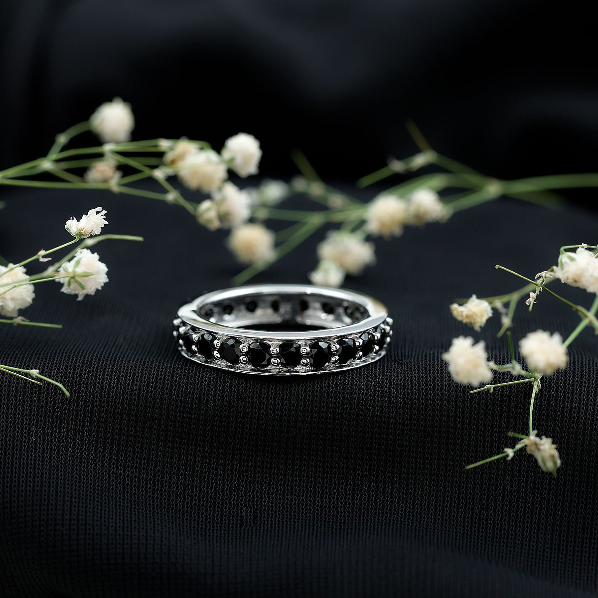 Black spinel eternity band ring from Rosec Jewels featuring a continuous row of sparkling black spinel stones in a sleek, elegant design.