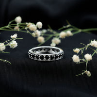 Black spinel eternity band ring from Rosec Jewels featuring a continuous row of sparkling black spinel stones in a sleek, elegant design.