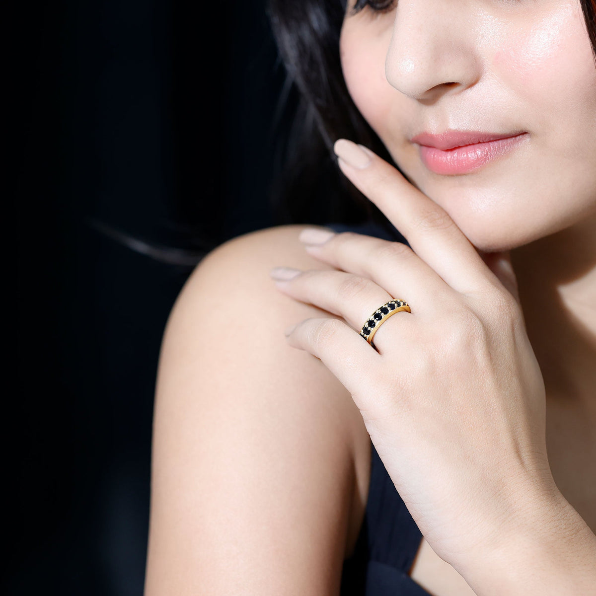 Black spinel eternity band ring with 2.25 carats of round cut stones, set in a sleek rose gold design from Rosec Jewels.