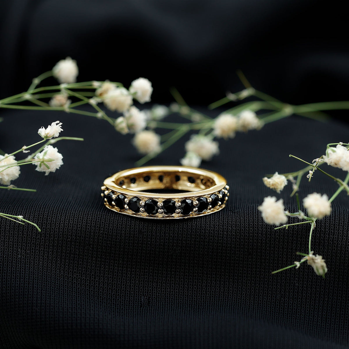 Black spinel eternity band ring with 2.25 carats from Rosec Jewels, showcasing a continuous circle of sparkling black gemstones.
