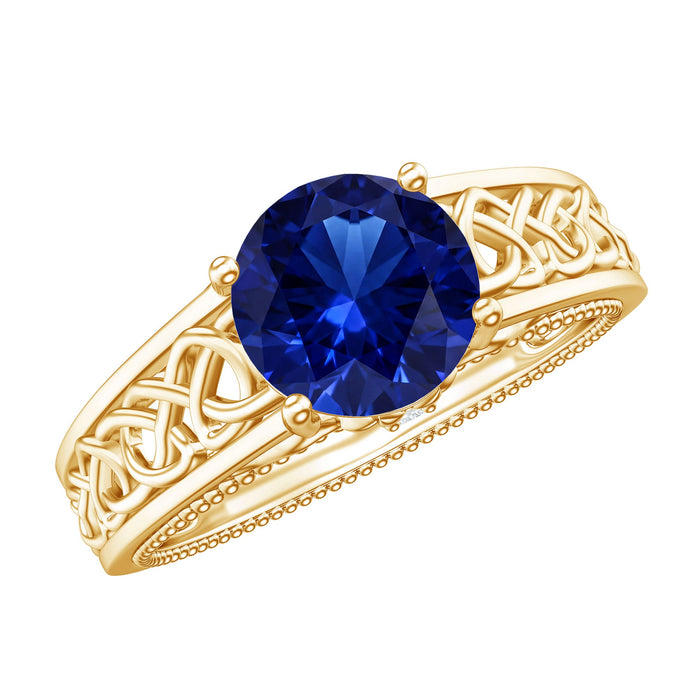 Lab grown blue sapphire Celtic engagement ring with a surprise diamond, crafted by Rosec Jewels, featuring intricate design and sparkling accents.