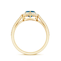 Heart-shaped London Blue Topaz engagement ring with diamond halo from Rosec Jewels, showcasing the detailed gemstone and elegant design.