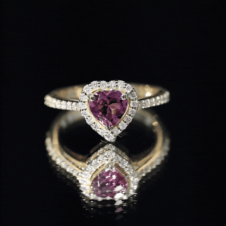 Heart-shaped pink tourmaline engagement ring with diamond halo from Rosec Jewels, showcasing a stunning pink gemstone and sparkling diamonds.