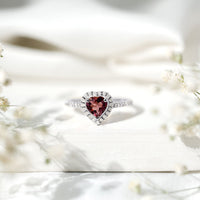 Heart-shaped pink tourmaline engagement ring with diamond halo, crafted by Rosec Jewels, featuring a stunning and romantic design.