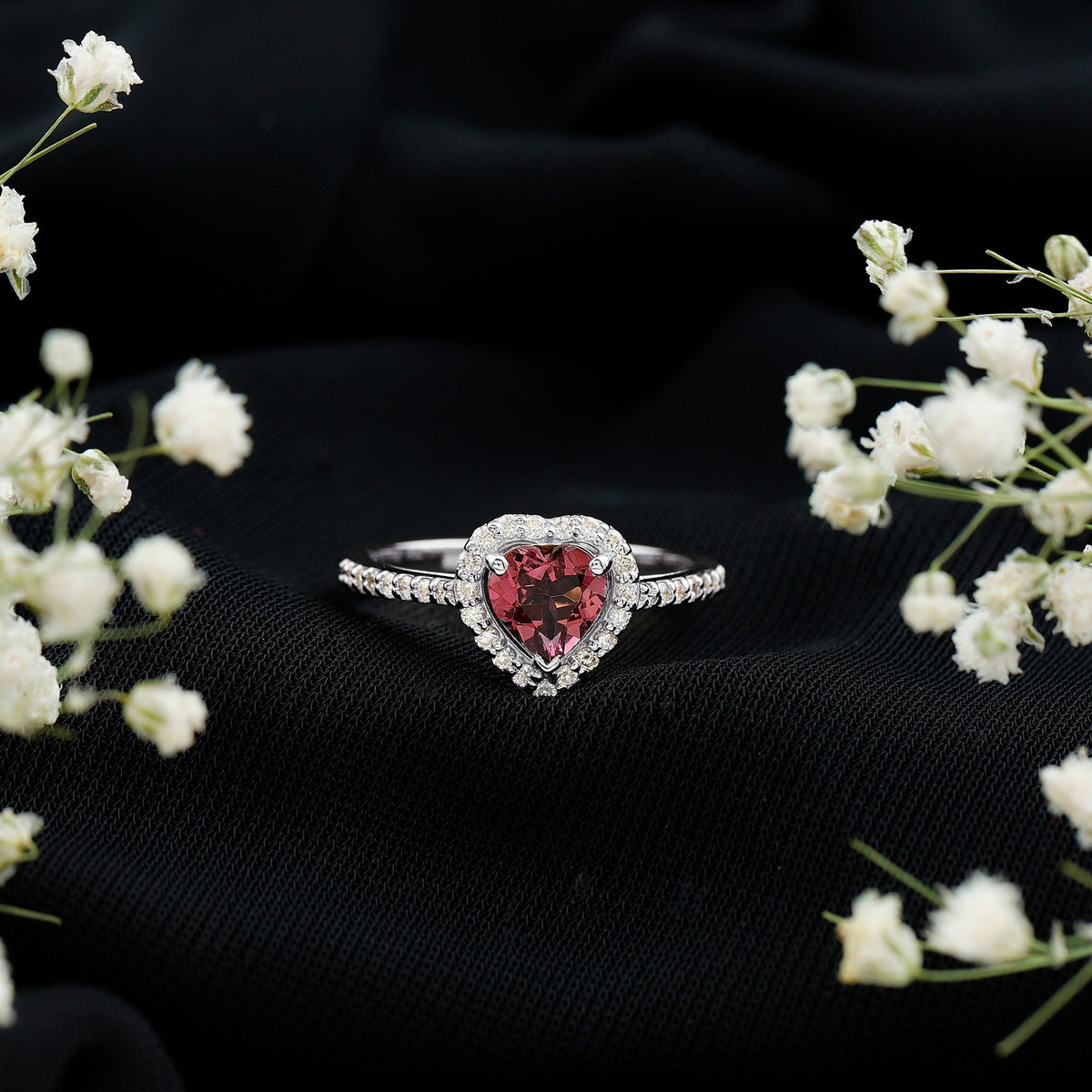 Heart-shaped pink tourmaline engagement ring with diamond halo, Rosec Jewels rings, featuring a romantic and sparkling design.