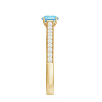 Certified real aquamarine solitaire ring with diamond side stones, featuring a silver band and elegant gemstone setting.
