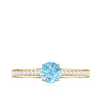 Certified real aquamarine solitaire ring with diamond side stones, featuring a silver band with intricate detailing.