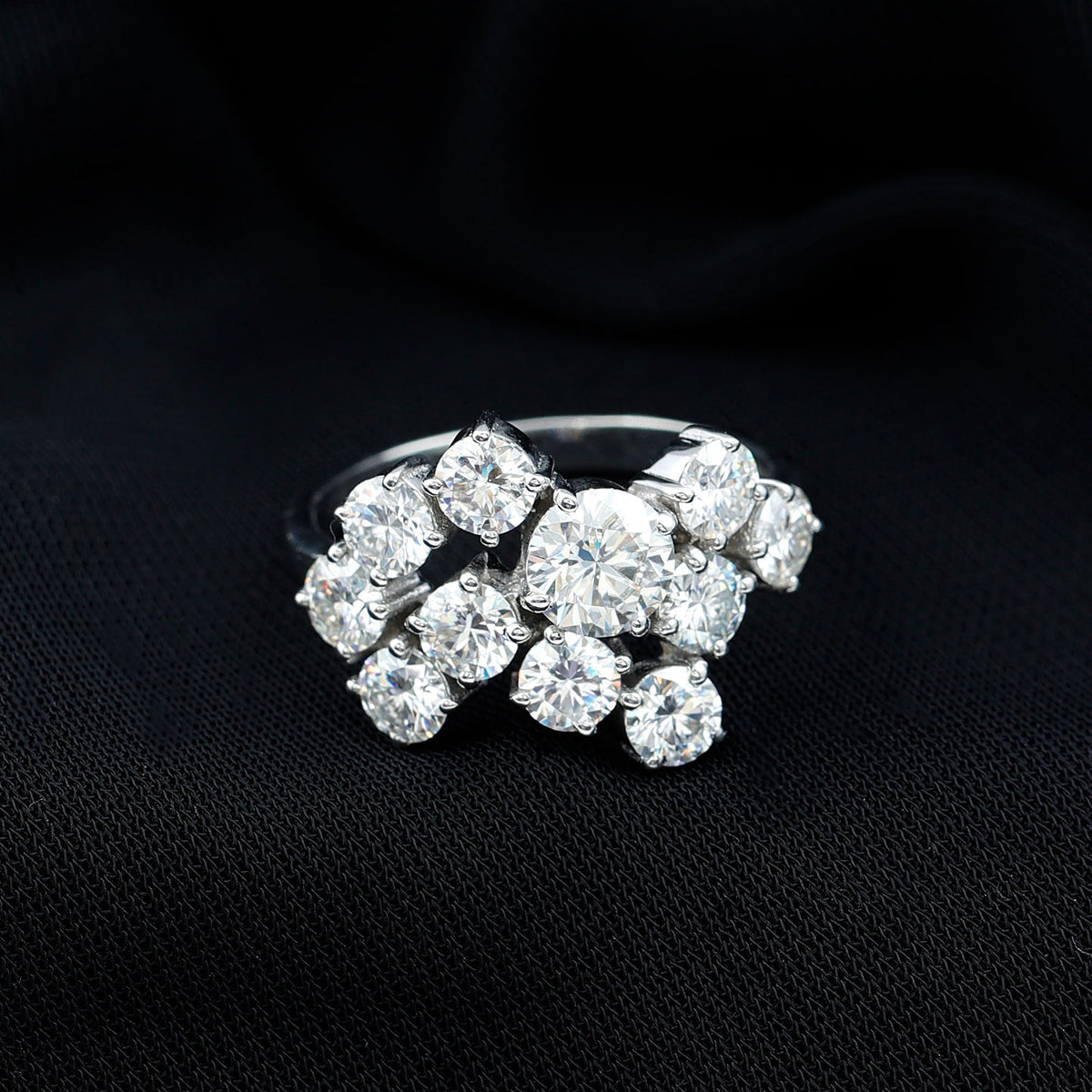 Silver moissanite cluster statement ring by Rosec Jewels featuring sparkling gemstone accents and intricate design.