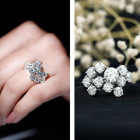 Silver moissanite cluster statement ring featuring sparkling gemstones, designed by Rosec Jewels for elegant jewelry.