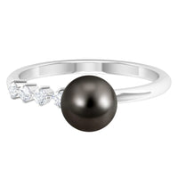 Rosec Jewels designer Tahitian pearl solitaire engagement ring with a diamond, showcasing a sleek band and elegant pearl centerpiece.