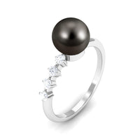 Tahitian pearl solitaire engagement ring with a diamond accent, crafted by Rosec Jewels, showcasing elegant jewelry design.