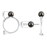 Tahitian pearl solitaire engagement ring with diamond from Rosec Jewels, featuring a lustrous black pearl and elegant band.