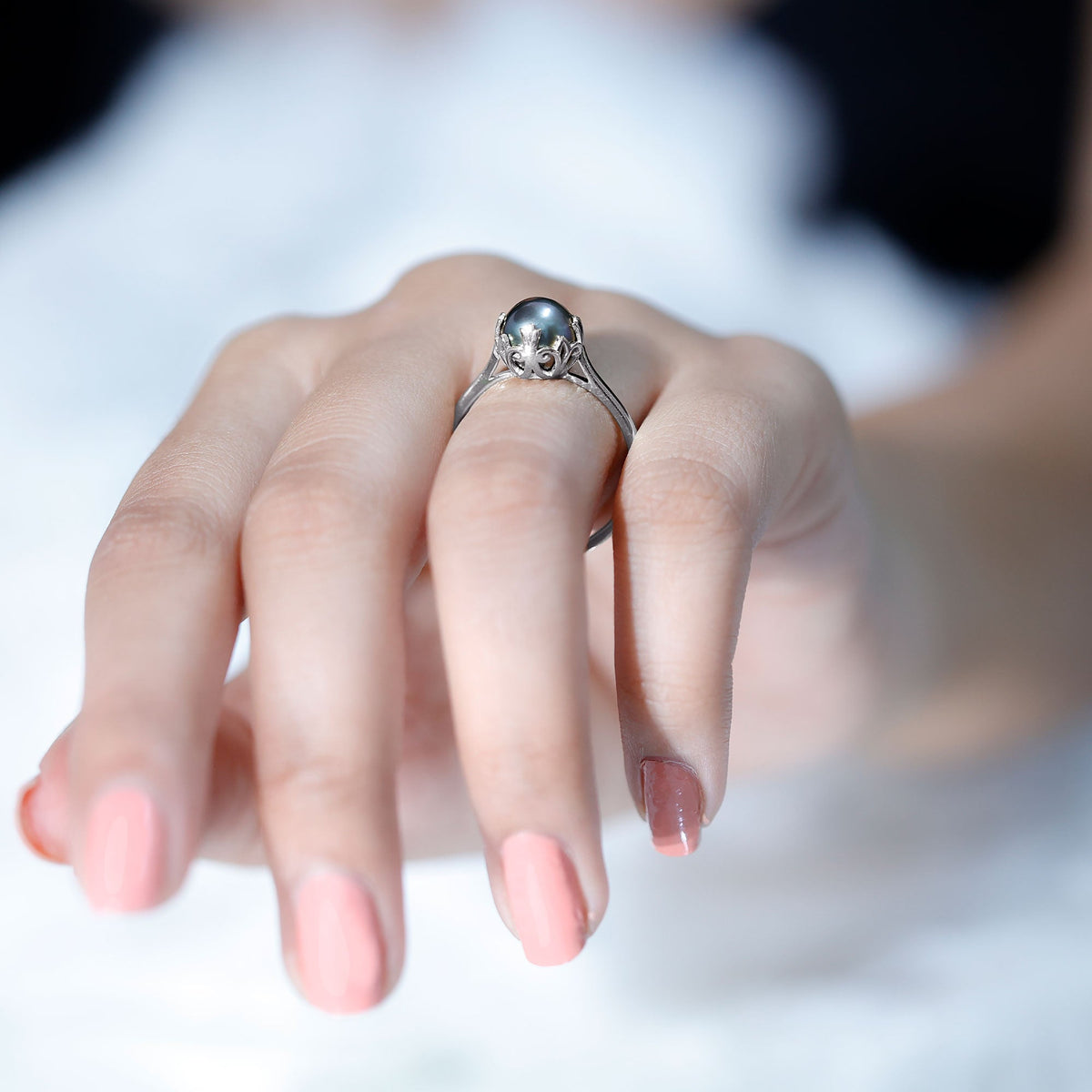 Handpicked genuine black Tahitian pearl engagement ring with silver band, featuring a lustrous black pearl set in a delicate rose gold design.