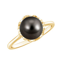 Handcrafted black Tahitian pearl engagement ring by Rosec Jewels featuring a polished black pearl set in a silver band.