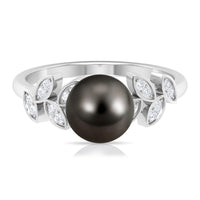 Tahitian black pearl and diamond leaf engagement ring by Rosec Jewels, featuring a delicate gold band and intricate leaf design.