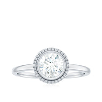 6mm round Moissanite solitaire engagement ring in bezel setting, showcasing a sparkling center stone and elegant band design.