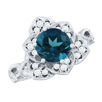 Rosec Jewels London Blue Topaz and Diamond cocktail flower engagement ring with intricate floral design and sparkling gemstones.