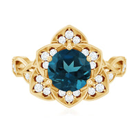 London Blue Topaz and diamond cocktail flower engagement ring featuring a silver band with intricate floral design by Rosec Jewels