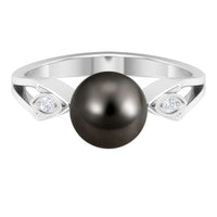 Solitaire Tahitian Pearl engagement ring with diamond by Rosec Jewels, featuring a lustrous black pearl and sparkling accent diamond.