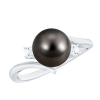 Vintage engagement ring featuring a natural Tahitian black pearl and diamond accents, crafted by Rosec Jewels.