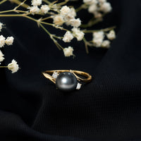 Natural Tahitian black pearl vintage diamond engagement ring by Rosec Jewels featuring a black pearl and sparkling diamonds.