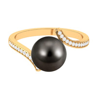 Tahitian pearl bypass engagement ring with diamond accents by Rosec Jewels, featuring a sleek silver band and elegant design.