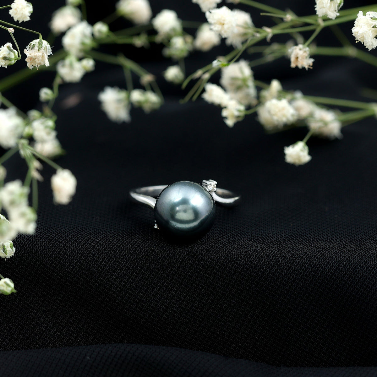 8 carat Tahitian pearl bypass engagement ring with diamonds by Rosec Jewels, showcasing a elegant pearl and sparkling diamond accents.