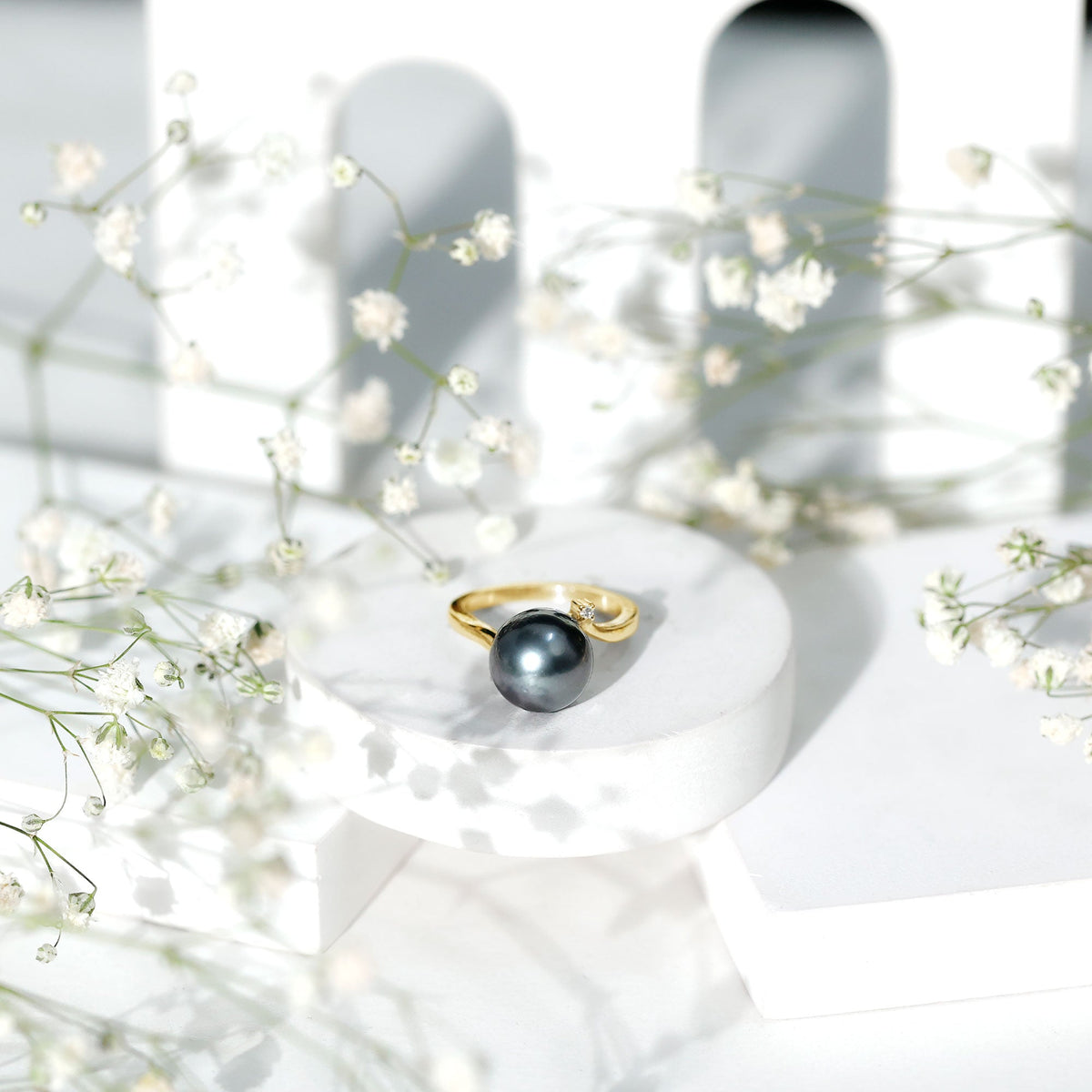 8 carat Tahitian pearl bypass engagement ring with diamonds by Rosec Jewels, showcasing the elegant pearl and sparkling accents.